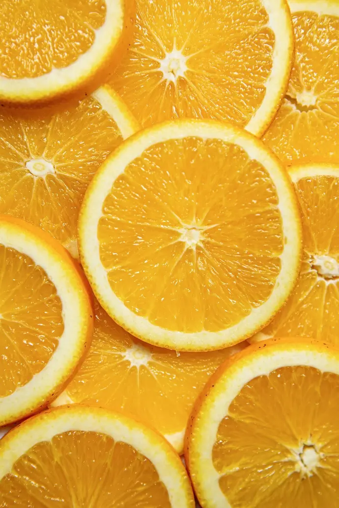 sliced orange fruit on white ceramic plate